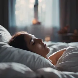 A close-up image of a person peacefully sleeping in a dimly lit bedroom, highlighting the importance of quality sleep in naturally regulating blood sugar levels.
