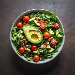 A vibrant photograph of a fresh and colorful salad made with leafy greens, cherry tomatoes, sliced avocados, and a sprinkle of nuts and seeds, highlighting the natural and nutritious foods that can help lower glucose levels.